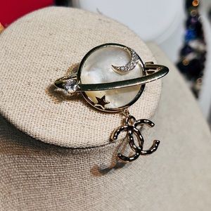 Chanel moon and star brooch